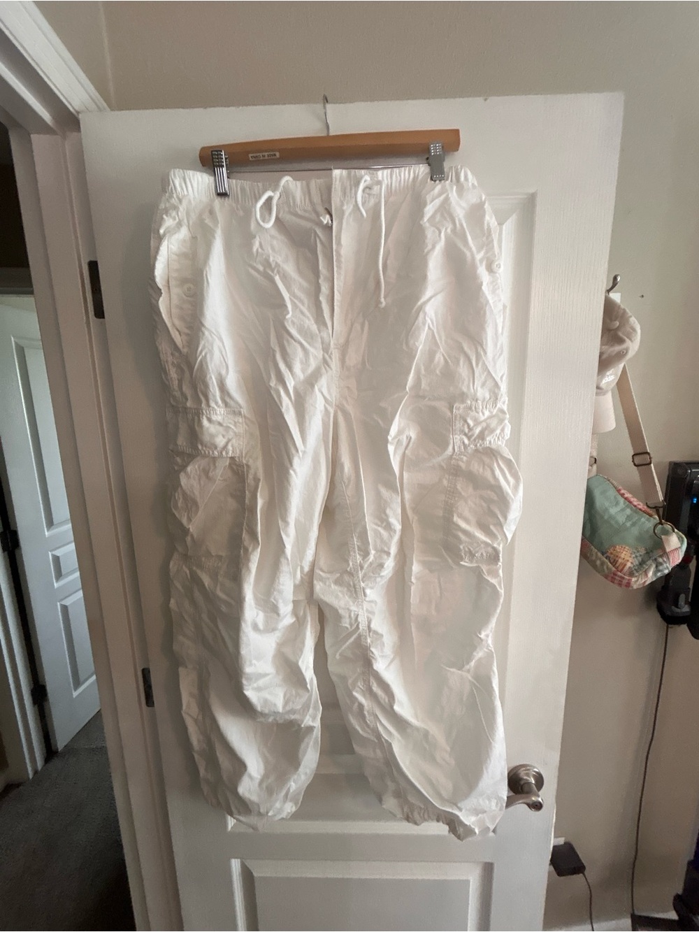Aritzia TNA white cargo supply parachute pants